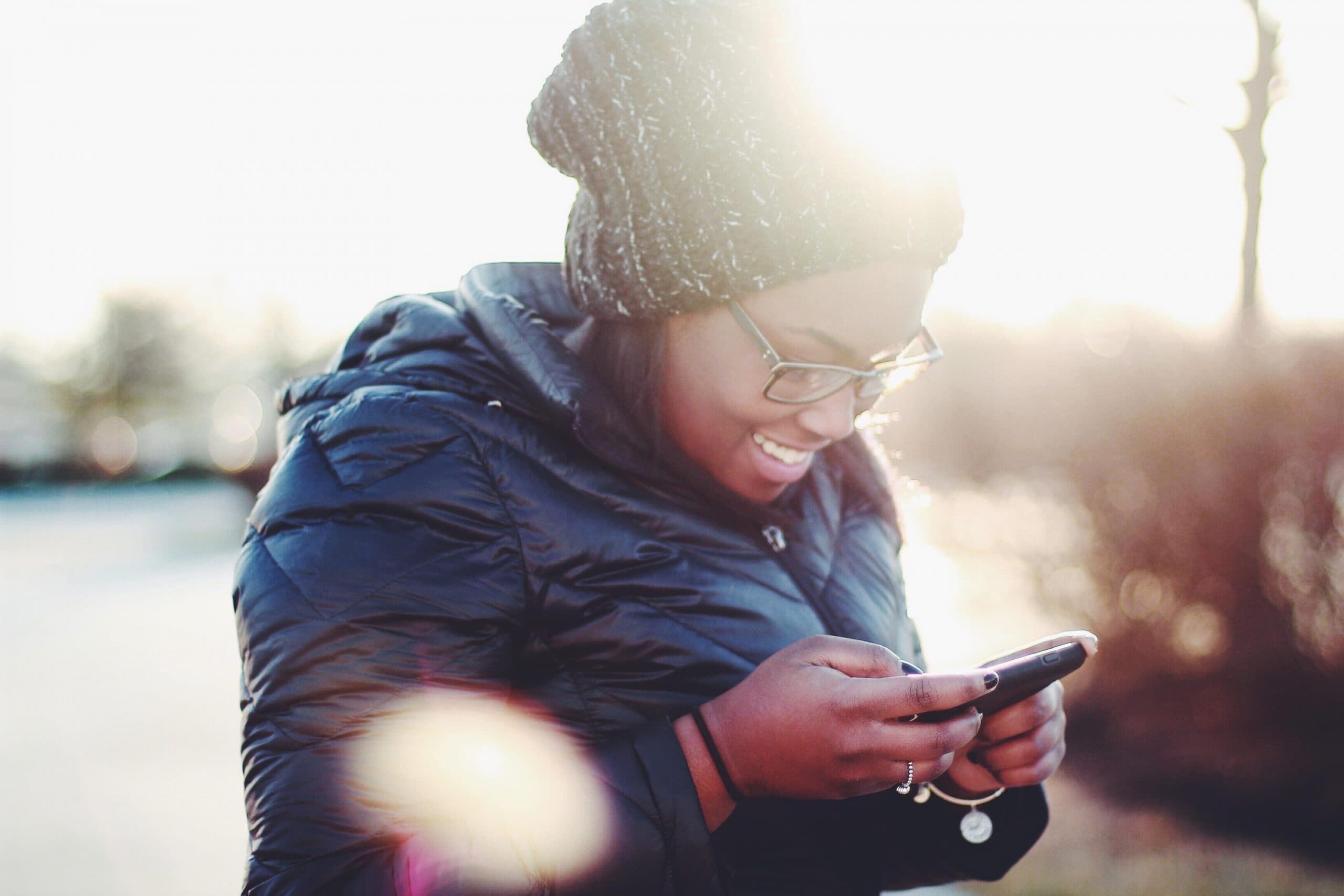 Woman using text recruiting on phone